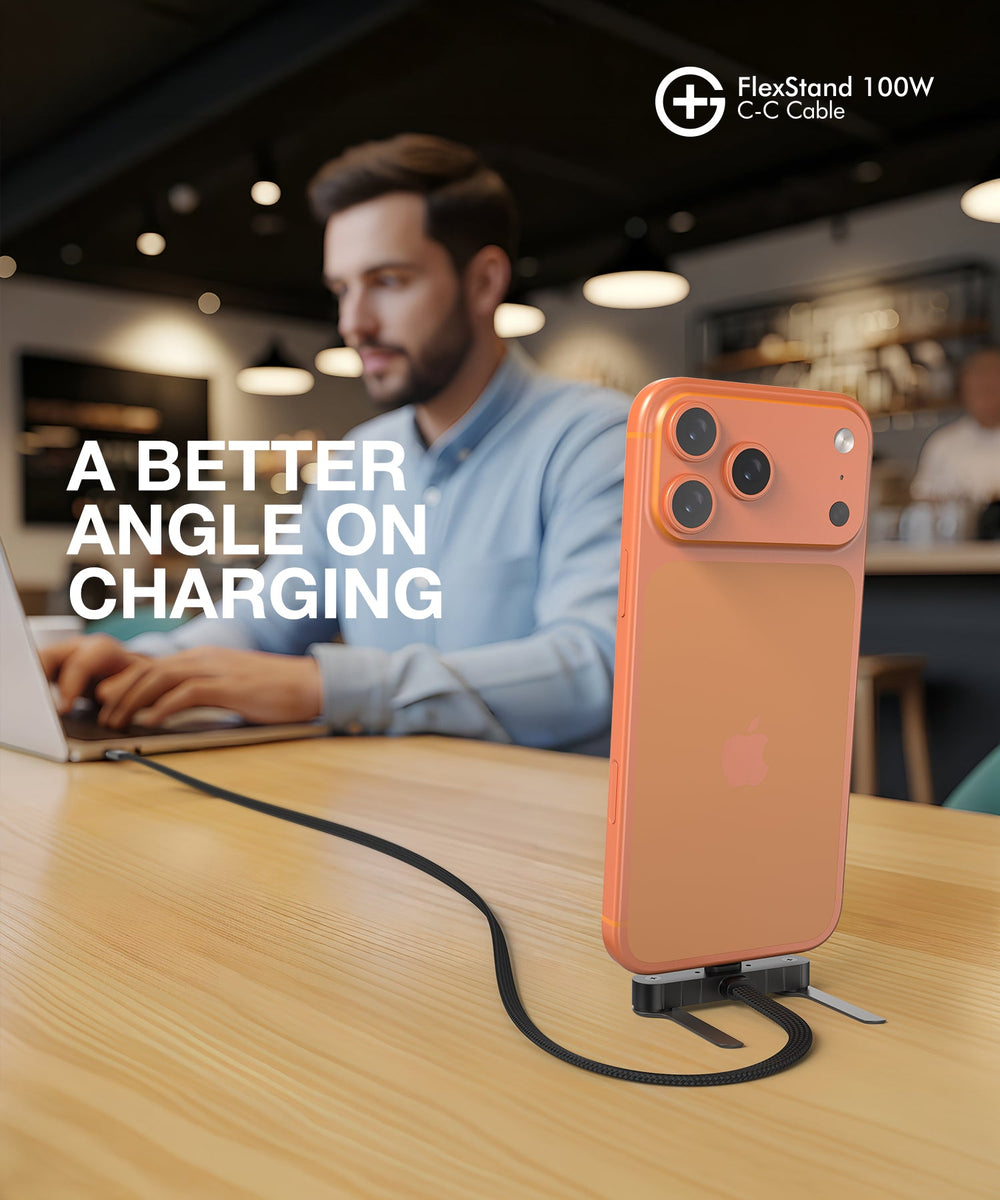 Phone standing upright on a desk while charging
