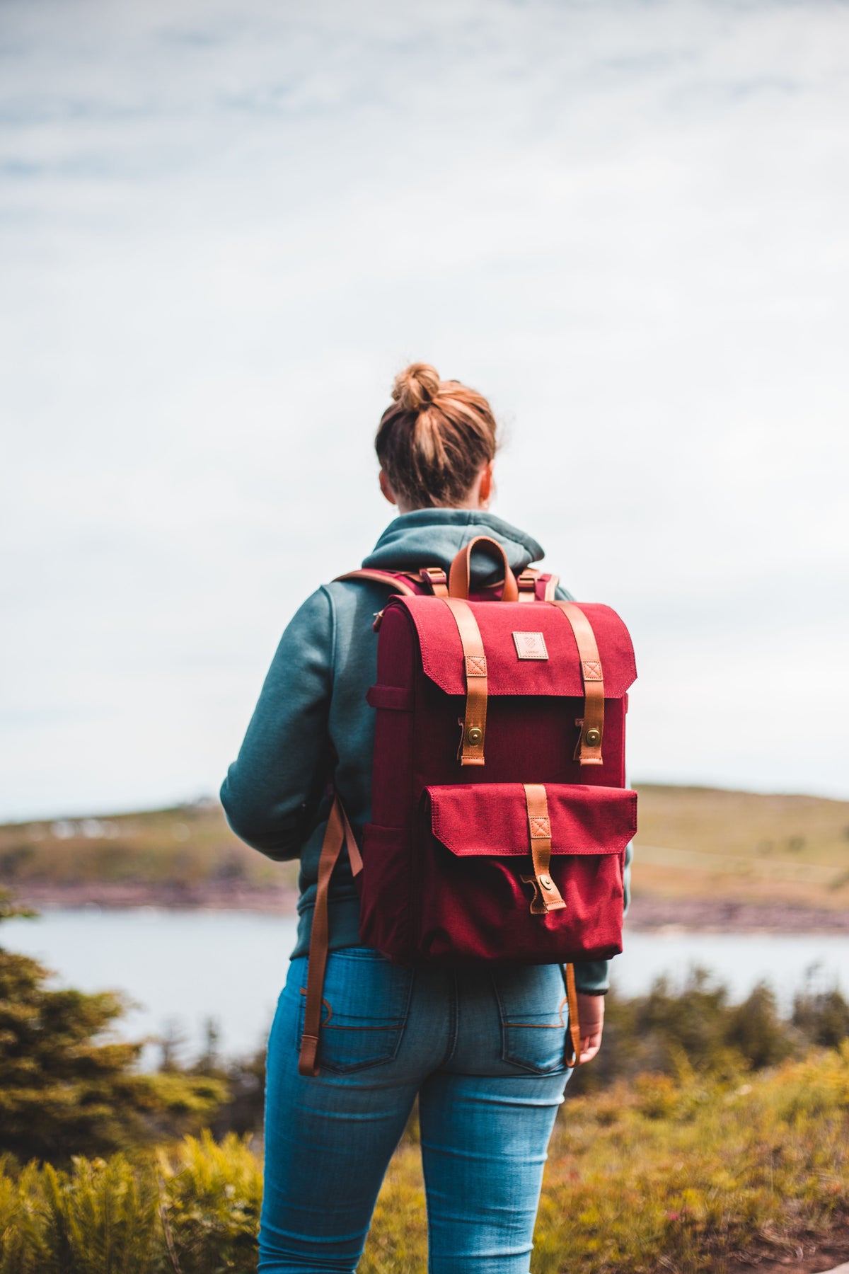 Canvas backpack against a wall