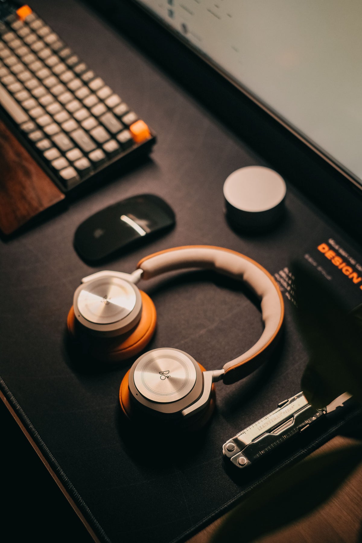 Camera, headphones and gadgets on a desk